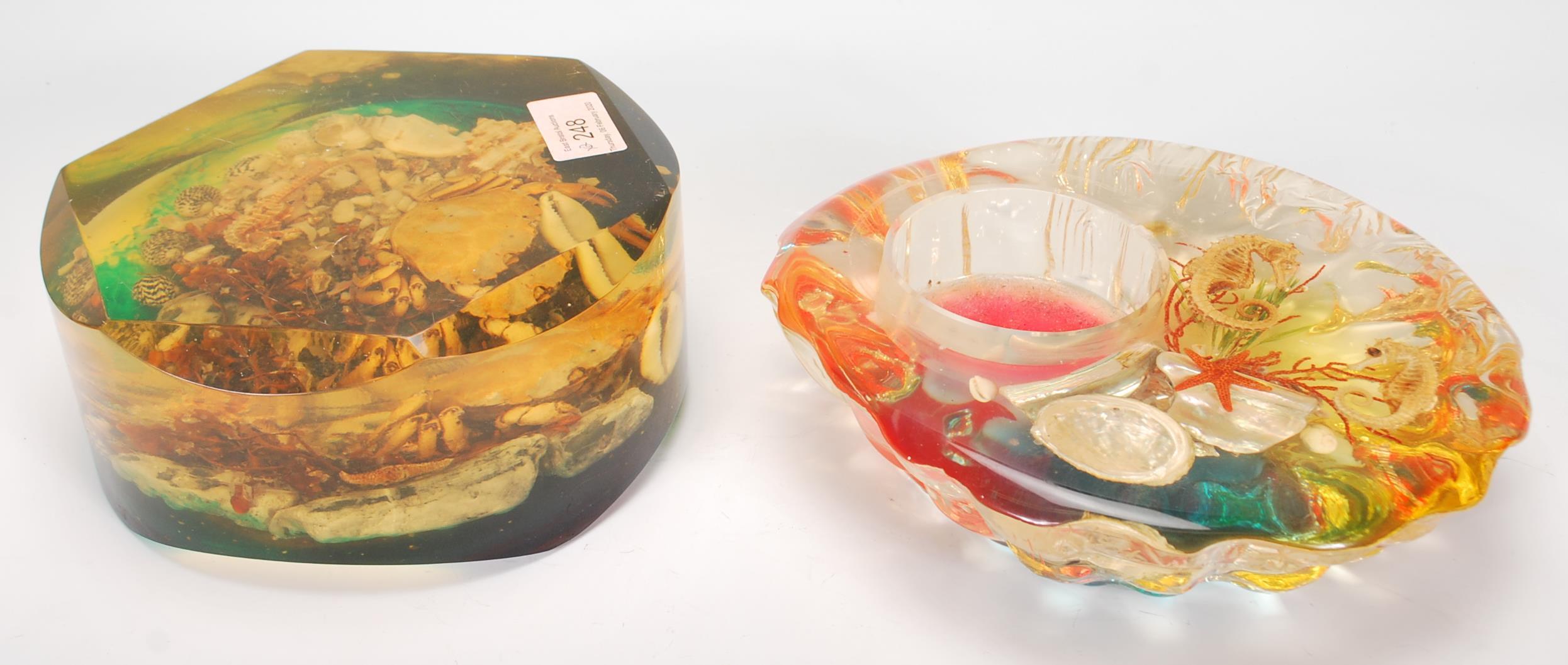 A pair of 1960's retro kitsch lucite large acrylic resin set marine / sea life paperweights with a