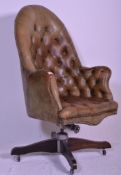 A good quality antique Chesterfield style green button backed leather swivel office chair. The 5