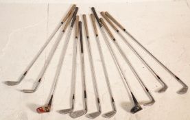 A set of vintage golf clubs most by Dai Rees, a John Jacobs driver, a Spalding top flite driver,