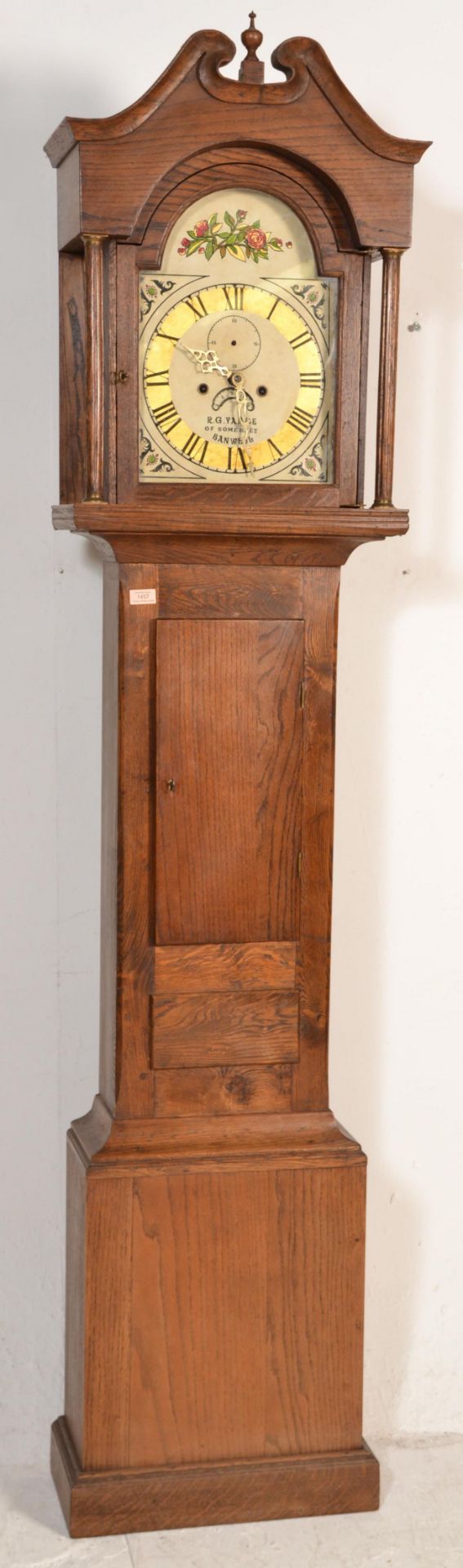 An early 20th Century long case grandfather clock having an oak body, the movement marked R G
