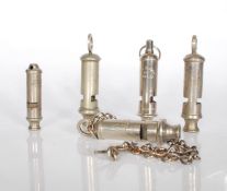 A group of five 20th century whistles to include two WWII ARP whistles, a Girl Guides of canada