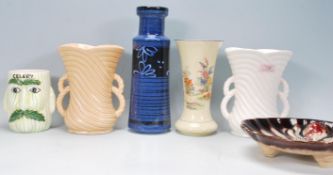 A collection of early 20th Century vintage pottery to include two Sylvac vases of reeded form having