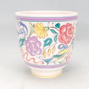 A vintage retro 20th Century Poole pottery LE pattern jardiniere having a cylindrical body raised on