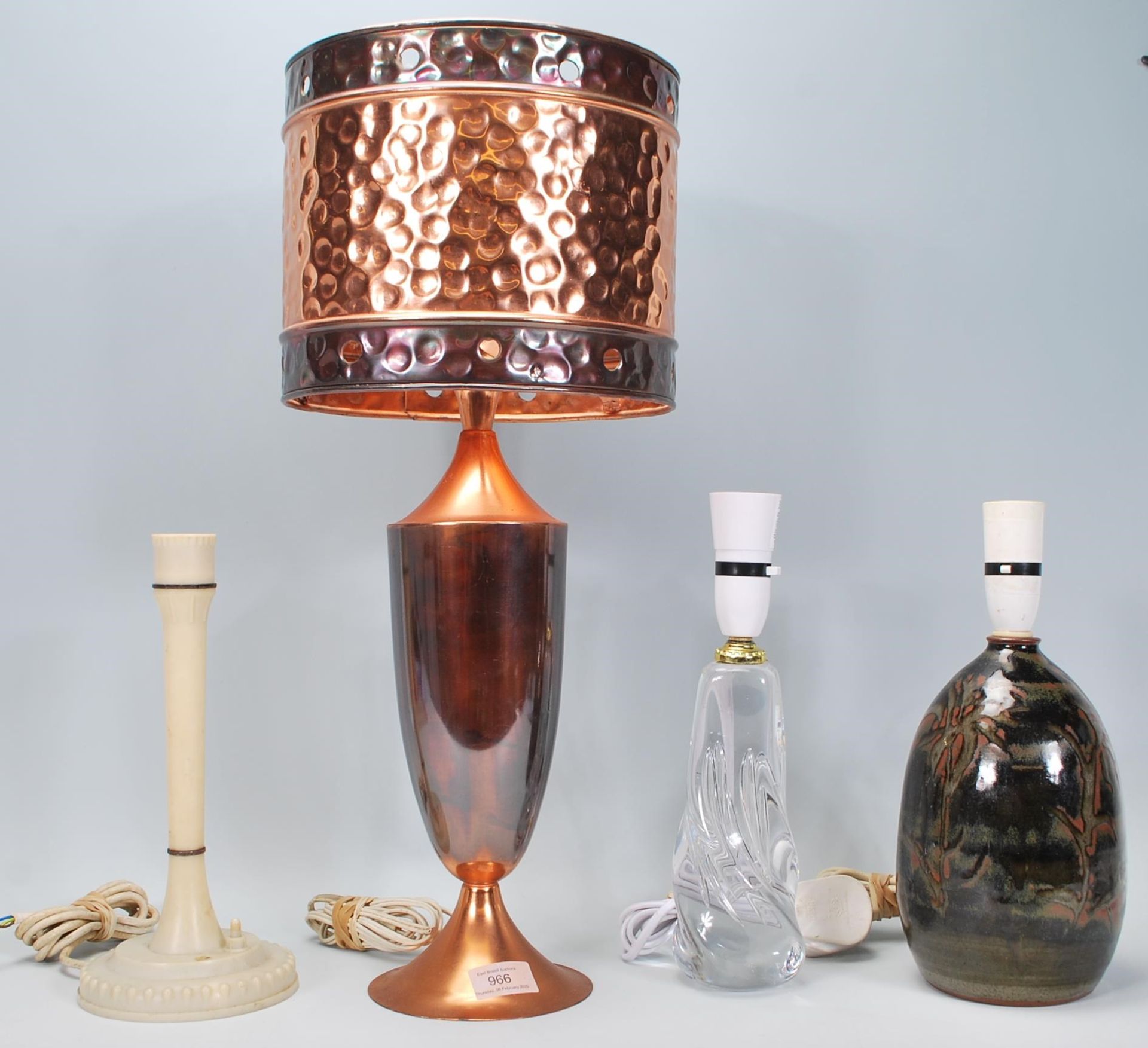 A good collection of four 20th century table / desk lamps to include an arts and craft style