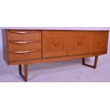 A retro Danish influenced mid century teak wood sideboard credenza  being raised on angled legs with