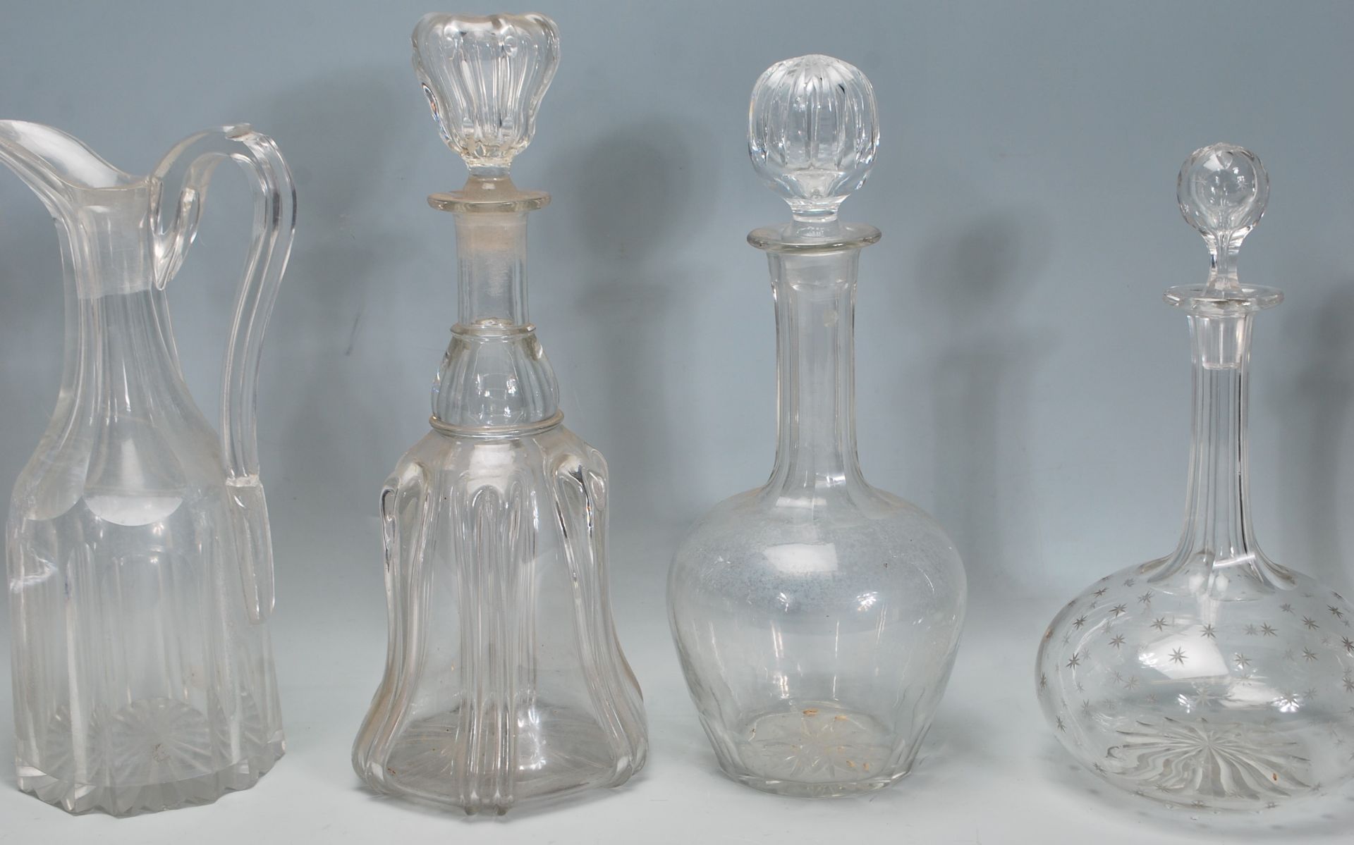 A good collection of mixed decanters dating from the 19th Century Georgian era to include a bell - Image 6 of 7
