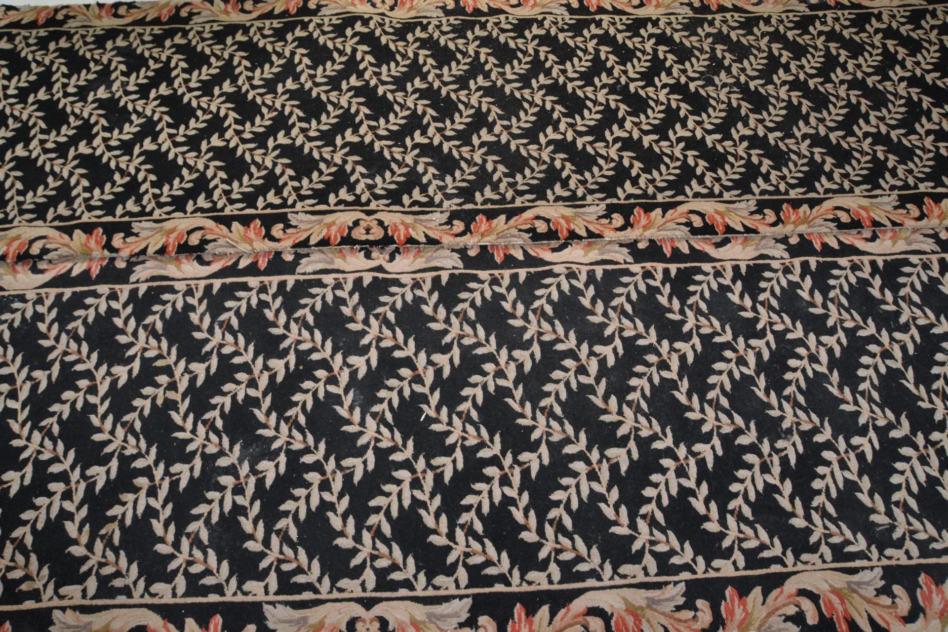 A matching pair of vintage 20th Century floor rug runners having black ground with cream floral - Image 4 of 5