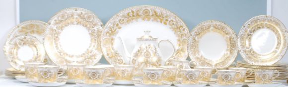 A Royal Crown Derby dinner service and tea service in the Brocade pattern having a white ground with