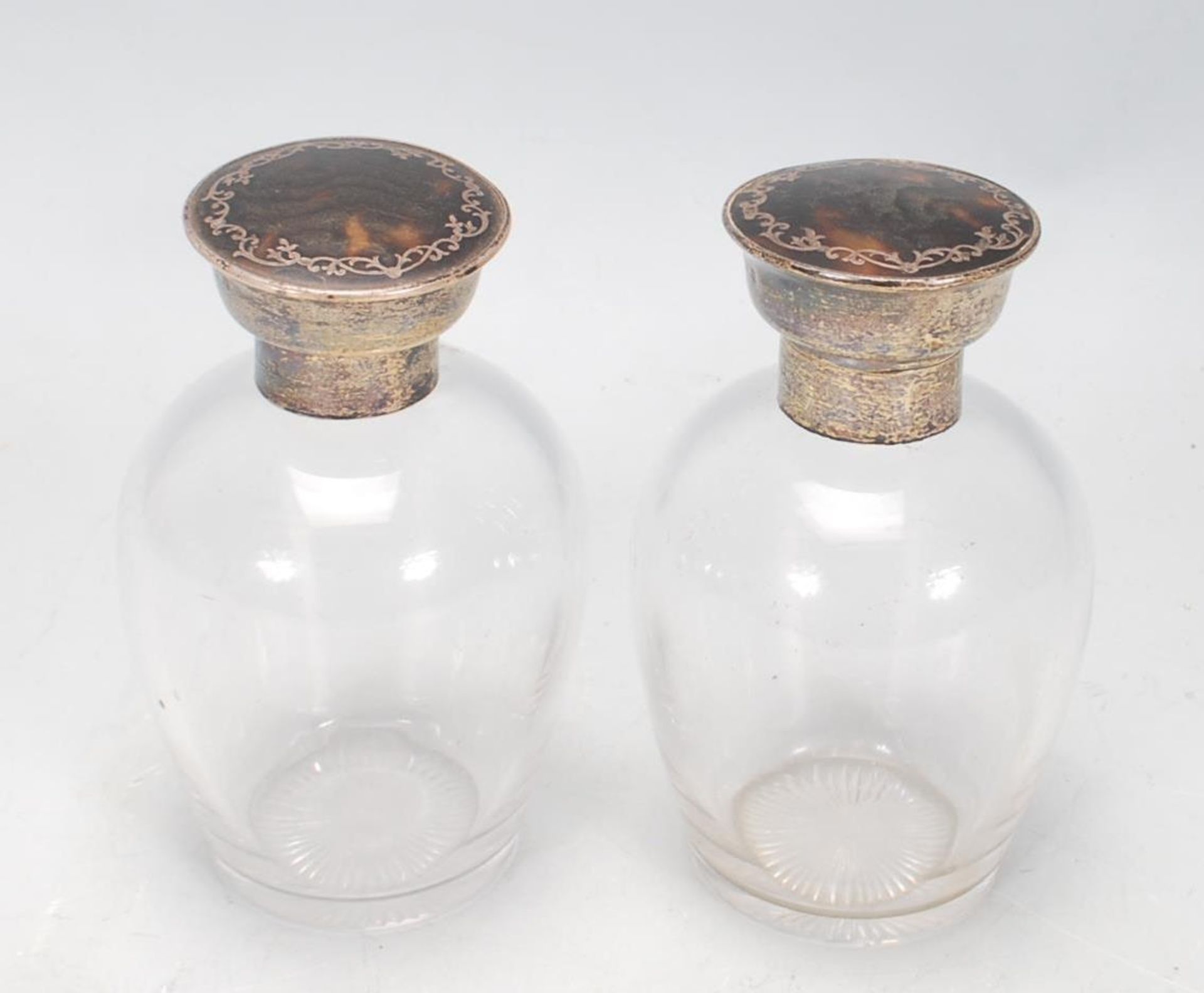 A pair of silver topped dressing table perfume bottles, each lid of round form set with tortoise - Image 2 of 5