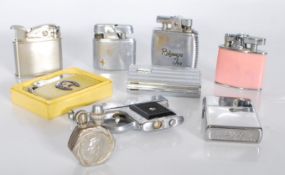 A collection of vintage 20th Century cigarette lighters to include a Ronson whale lighter, a Mars