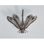 A silver ladies brooch in the form of a dragonfly. Stamped 925. Marcasites cover the entirety of the