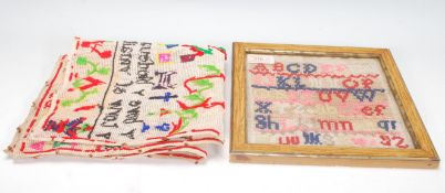 An early 20th Century Welsh sampler worked by Sophia Evans. Translated reads 'This sampler was