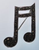 A silver and marcasite brooch in the form of a mus