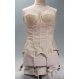 A mid 20th Century 1950's corset having ribbed con