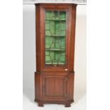 A 19th century mahogany freestanding corner cupboa