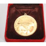 A silver hallmarked Swedish 24K gold plated medal