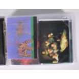 An album of lenticular holographic postcards, subj