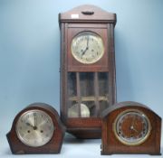 Two early 20th Century oak cased Art Deco mantel c