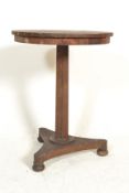 A Regency 19th century rosewood wine table being r