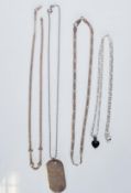 A selection of silver necklaces to include a playb
