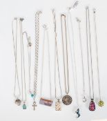 A selection of silver pendant necklaces to include