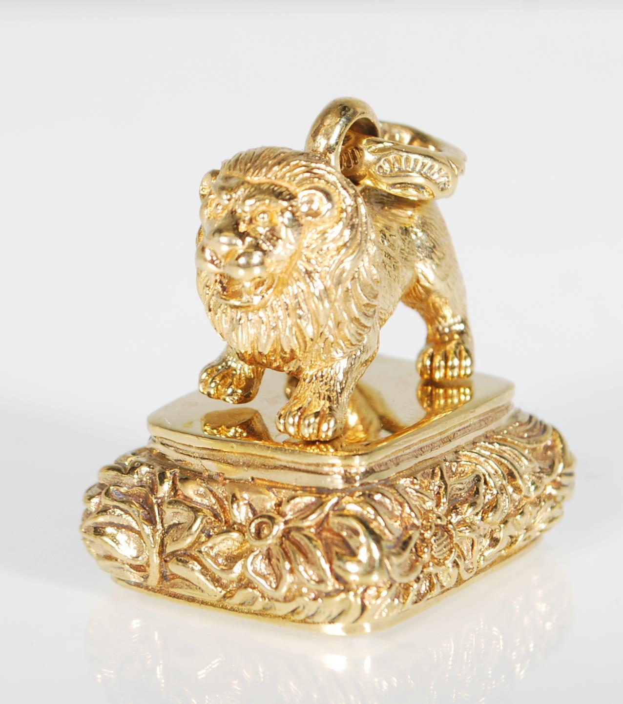 A brass seal of square form having a lion mount at