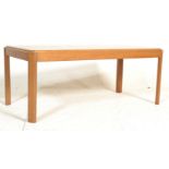 A retro mid 20th Century teak wood coffee table of