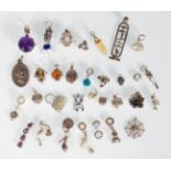 A selection of silver charms and pendants to inclu