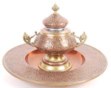 19TH CENTURY ISLAMIC COPPER AND BRASS INKWELL AND STAND