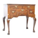 EARLY 19TH CENTURY WALNUT LOWBOY WITH CARVED APRON