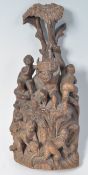 EARLY 18TH CENTURY CARVED FIGURINE GROUP OF CHERUBS CLIMBING TREE