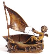 AFTER AUGUSTE MOREAU - BRONZE CHERUB IN BOAT STATUE