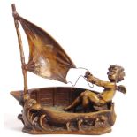 AFTER AUGUSTE MOREAU - BRONZE CHERUB IN BOAT STATUE