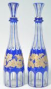 PAIR OF 19TH CENTURY BLUE AND WHITE GILT OVERLAY DECANTERS