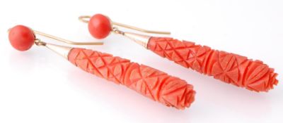 A pair of early 19th century coral drop earrings. The earring having large drops carved with