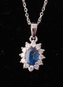 18CT WHITE GOLD SAPPHIRE AND DIAMOND PENDANT AND NECKLACE