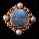 An Edwardian intaglio diamond moonstone and pearl brooch pin. The pin set with a central intaglio