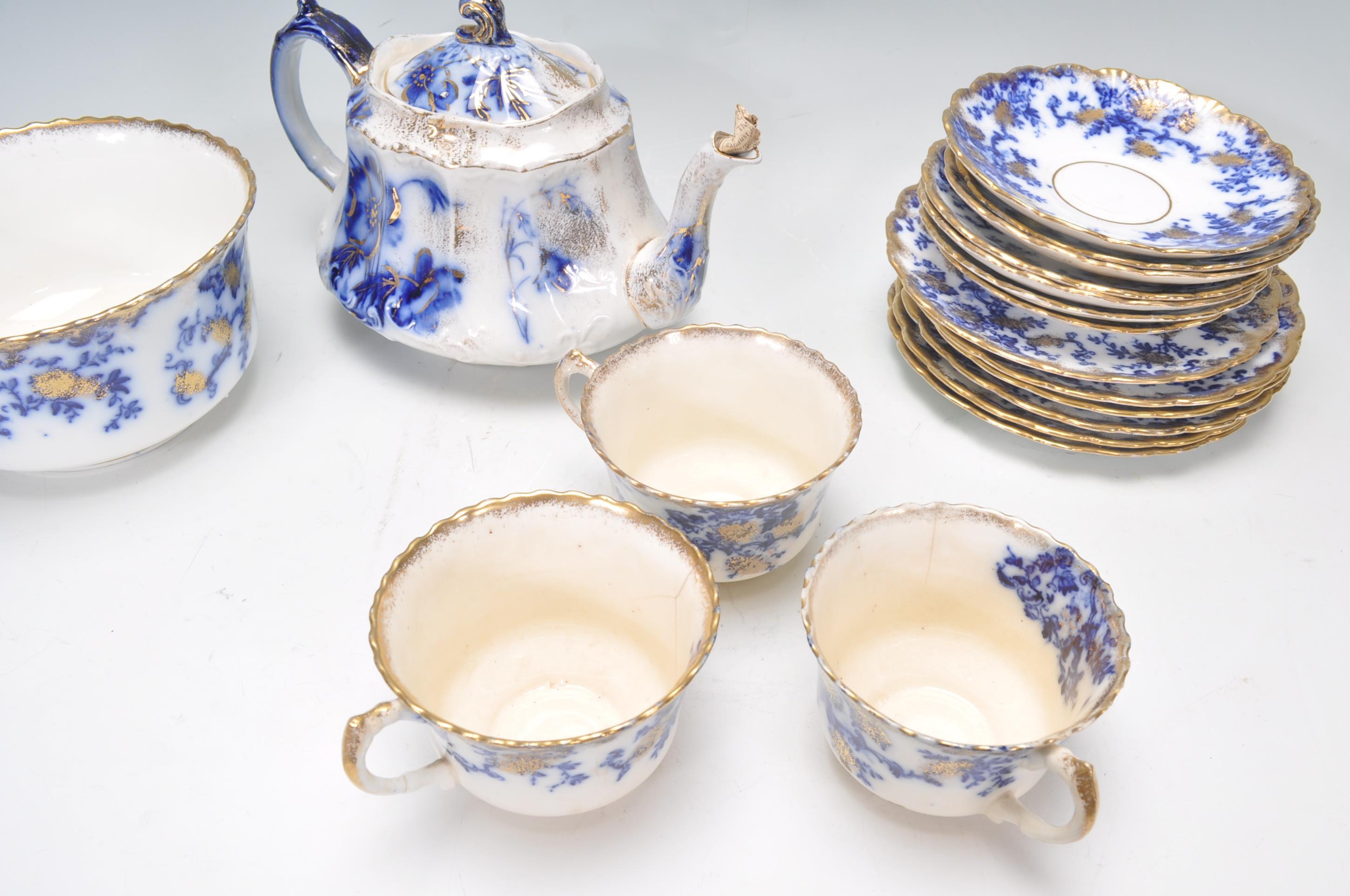 A collection of Victorian 19th century flow blue china to include dinner plates, teapot, cups, sugar - Image 2 of 8