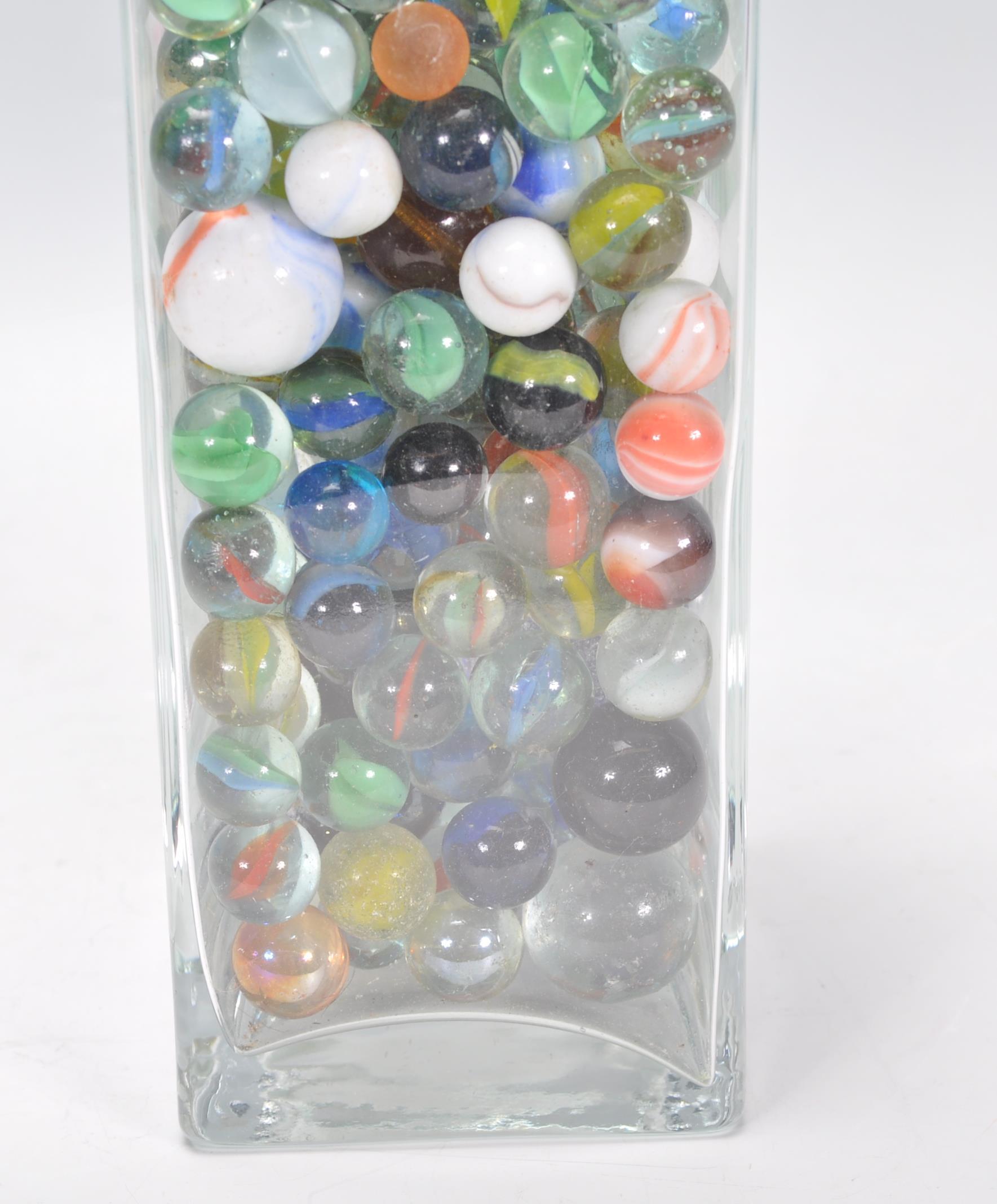 A collection of marbles to include glass cats eye marbles, some white and coloured glass examples, - Image 10 of 11