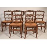 A set of 6 mid century French provincial oak and rattan weave dining chairs. Raised on squared