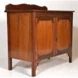 An Edwardian mahogany shoe cupboard. Raised on squ