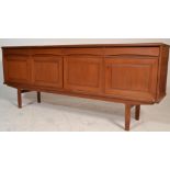 A mid century Scandinavian / Danish design teak wood sideboard credenza being raised on square