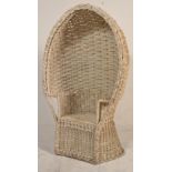 A 20th Century vintage / retro 1970's retro wicker peacock armchair / chair finished in white having