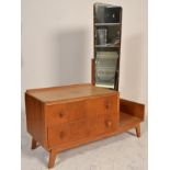 A retro mid century oak drop side dressing table chest by Ernest Gomme for G-Plan. Raised on