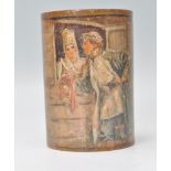 An early 20th Century wooden brush pot of cylindrical form with a hand painted couple scene and