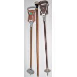 A 20th Century walking stick cane having a tapering wooden shaft with a bulbous cast resin knob to