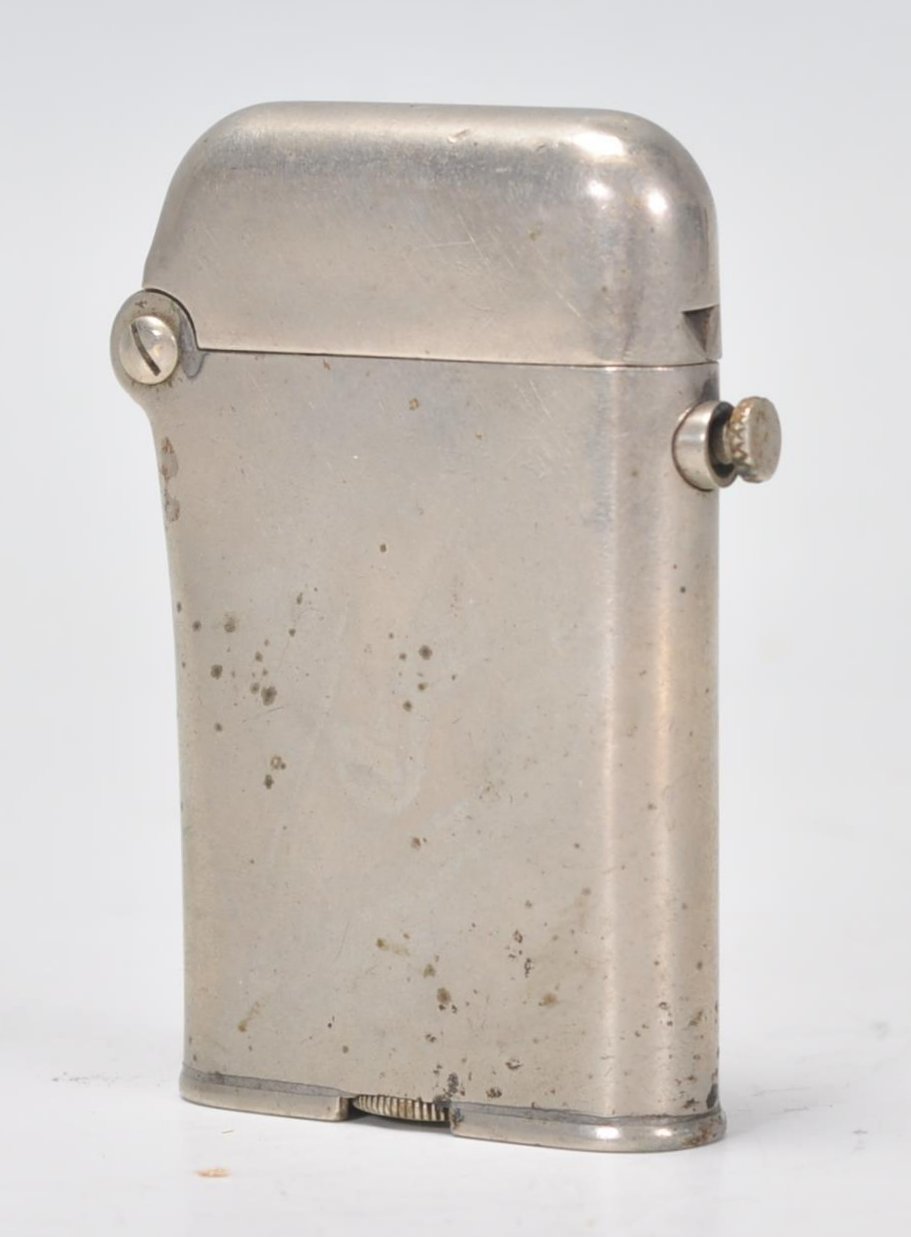 A vintage early 20th Century Thorens Swiss made lighter. Stamped to base Brit. PAT January 29.