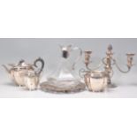 A collection of silver plated items to include a good silver plate and cut glass claret decanter,