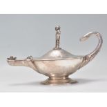 A 19th Century Victorian silver hallmarked genie oil lamp having finely engraved floral and scroll