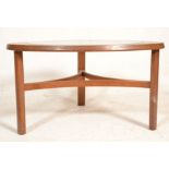 A vintage retro mid 20th Century G-Plan type astro coffee table of rounded triangular form having